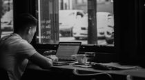 A man in front of a computer