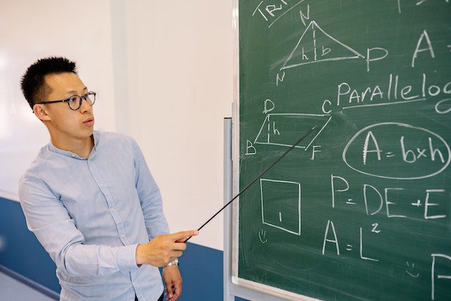 Teacher teaching physics