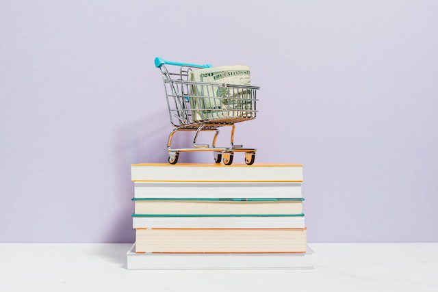 Pexels - Shopping Cart on Top of Books