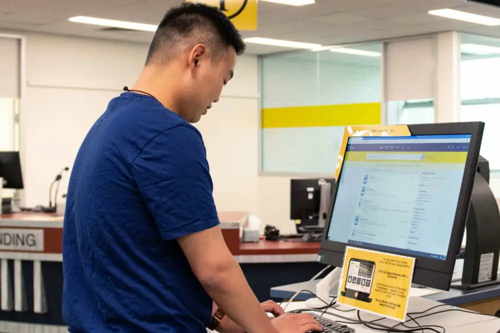 College Student Working on His Laptop