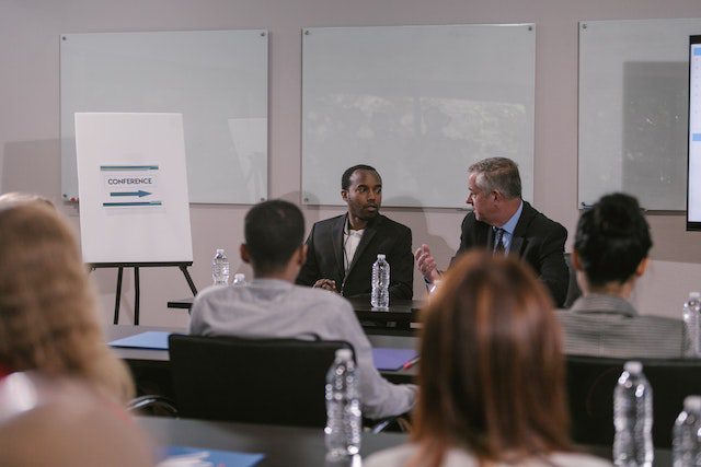 Speakers Talking at a Business Conference