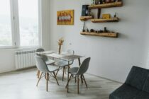 Gray Dining Chairs and Glass Table in a Room