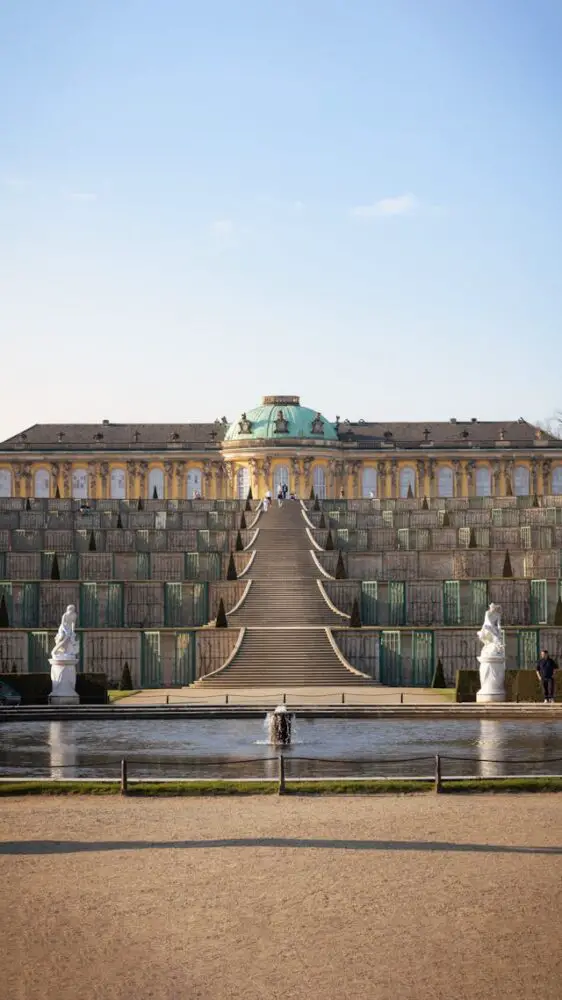 a large building with a fountain in front of it