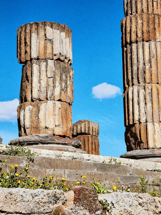 ancient ruins of pompeii columns against blue sky