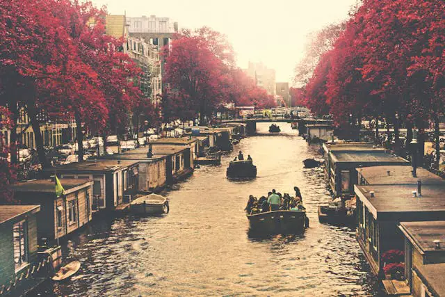 brown water boat floating on body of water