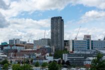 city skyline under cloudy sky