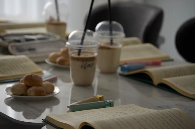 cozy study scene with coffee and notebooks