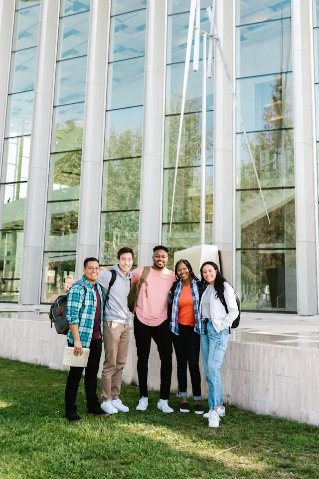 group of people standing near glass building