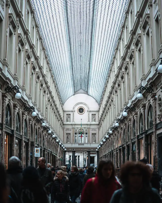 group of people walking on hallway inside building