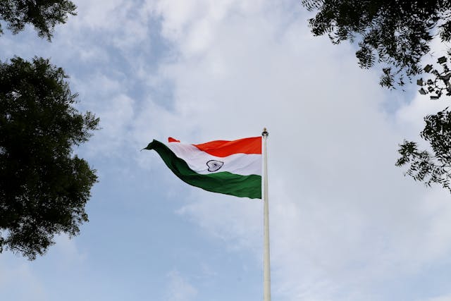 low angle shot of the indian flag on a mast