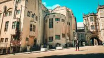 man walking by the bristol central library bristol england