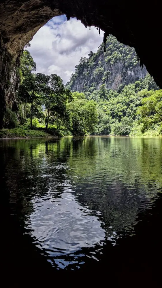 photo of a scenic landscape captured from a cave