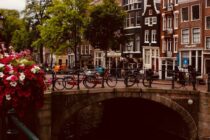 photo of bicycles near bridge at daytime