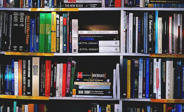 photography of books on bookshelf