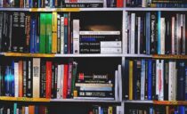 photography of books on bookshelf