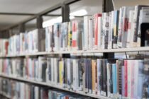 shallow focus photography of books on bookshelves