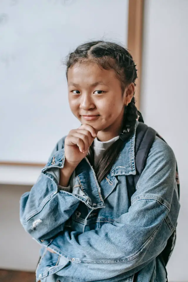 thoughtful ethnic girl looking at camera