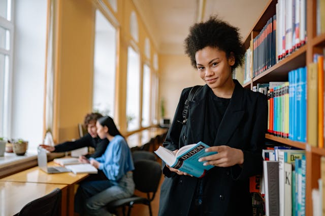 woman standing in a library