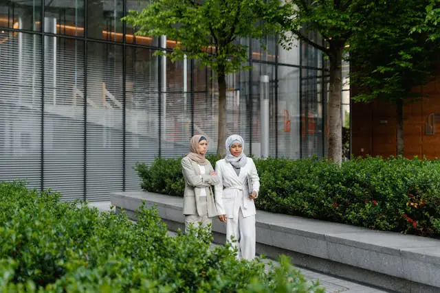 women standing near the building