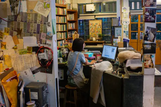 photo of a woman with short hair working on a computer