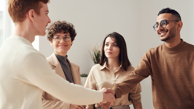 photo of people doing handshakes