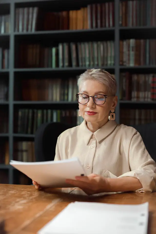 professional drama professor looking at a script