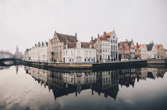 white and brown concrete buildings near bodies of water