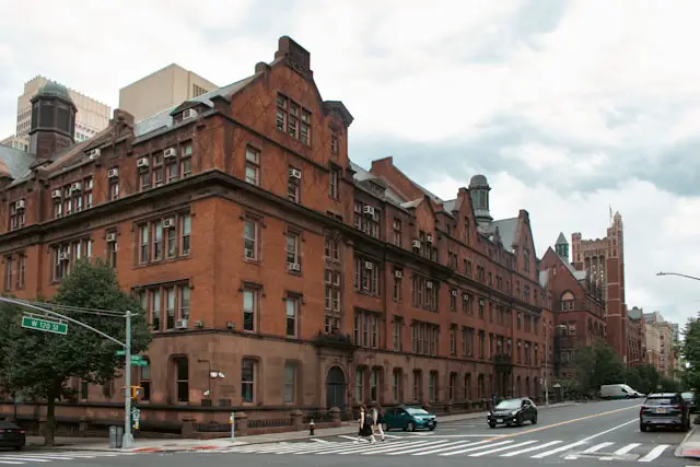 a city street with cars parked on the side of it