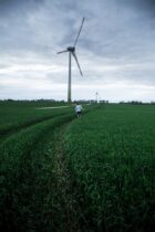 a man walking on the grass field