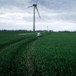 a man walking on the grass field