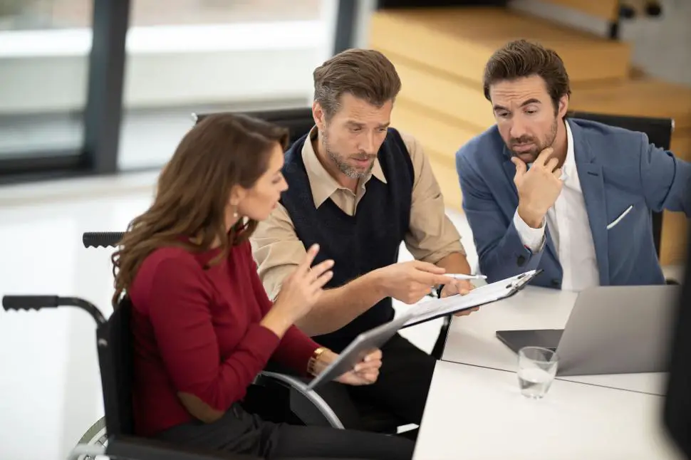 Free Stock Photo of Business team reviewing documents together