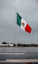 monumental mexican flag waving on a rainy day in puebla