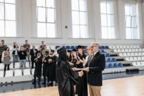 photo of woman receives her diploma