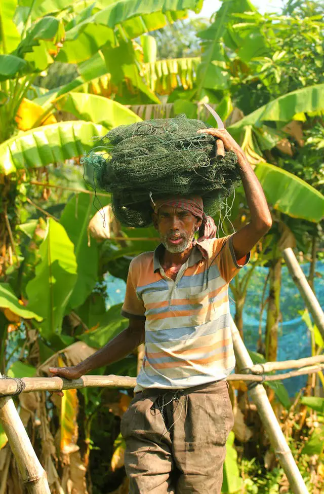 portrait of a fisherman in a lush environment