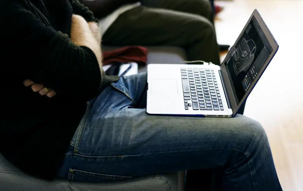 Free Stock Photo of An automobile designer sitting with his laptop