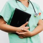 a doctor holding a digital tablet