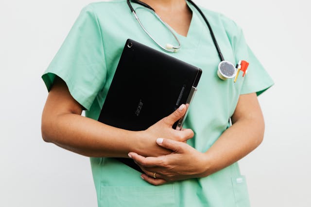 a doctor holding a digital tablet