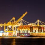 cargo ship on dock during nighttime