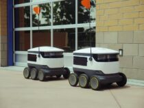 delivery robots parked beside building