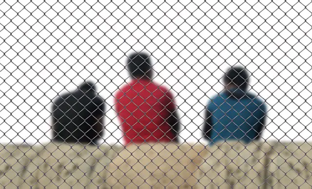 fence men refugee integration