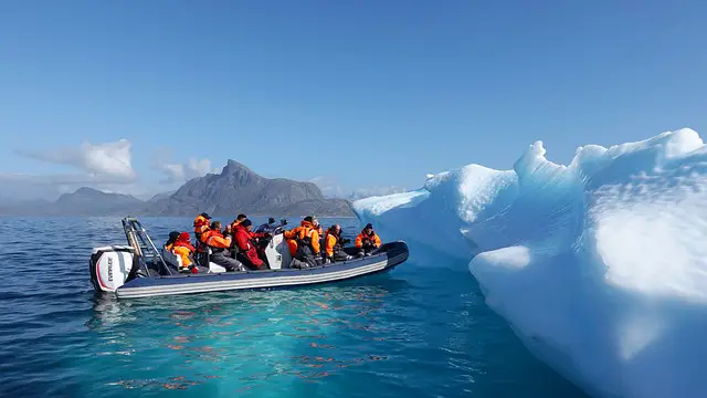 iceberg ice greenland tourism boat