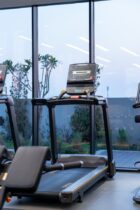 modern treadmills in a dubai gym at twilight