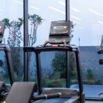 modern treadmills in a dubai gym at twilight