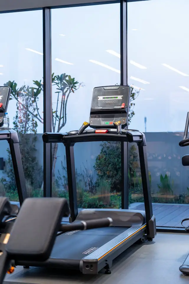 modern treadmills in a dubai gym at twilight