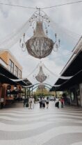 outdoor mall with decorative chandeliers