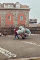 urban scene recycler with cart of bottles