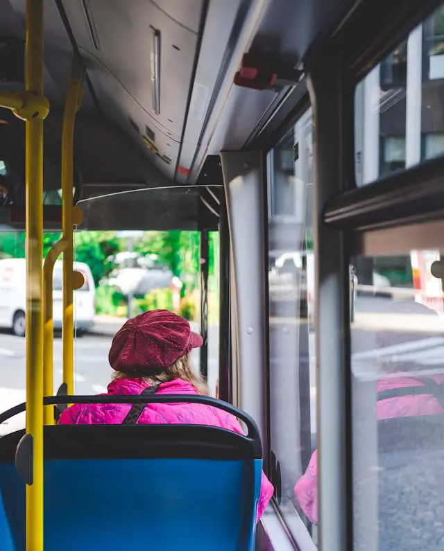 woman sitting inside bus