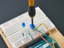 a soldering tool is attached to a bread board