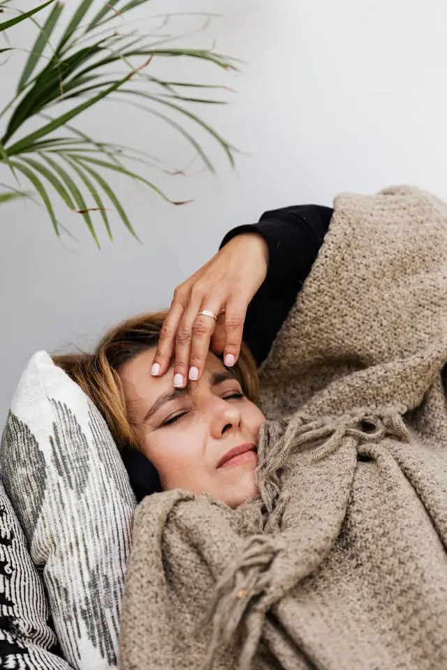 a woman covered with a blanket