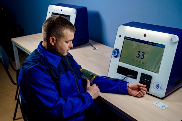 man checking his blood pressure